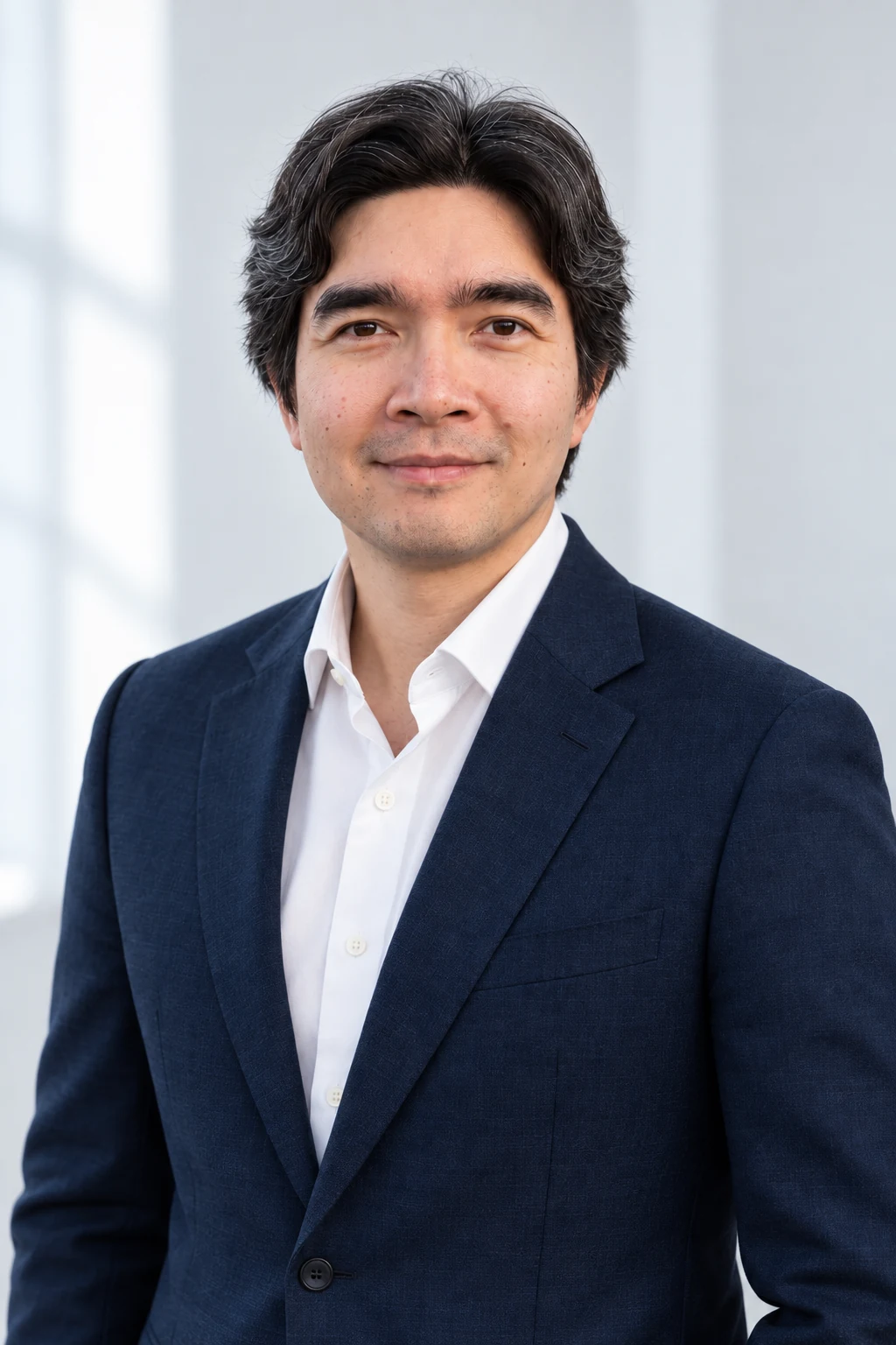 Dr. Jeremiah Lasquety-Reyes, founder of LASQR, in a Prussian blue suit and white shirt